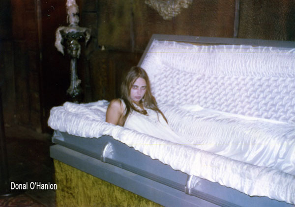 [Anita in coffin]